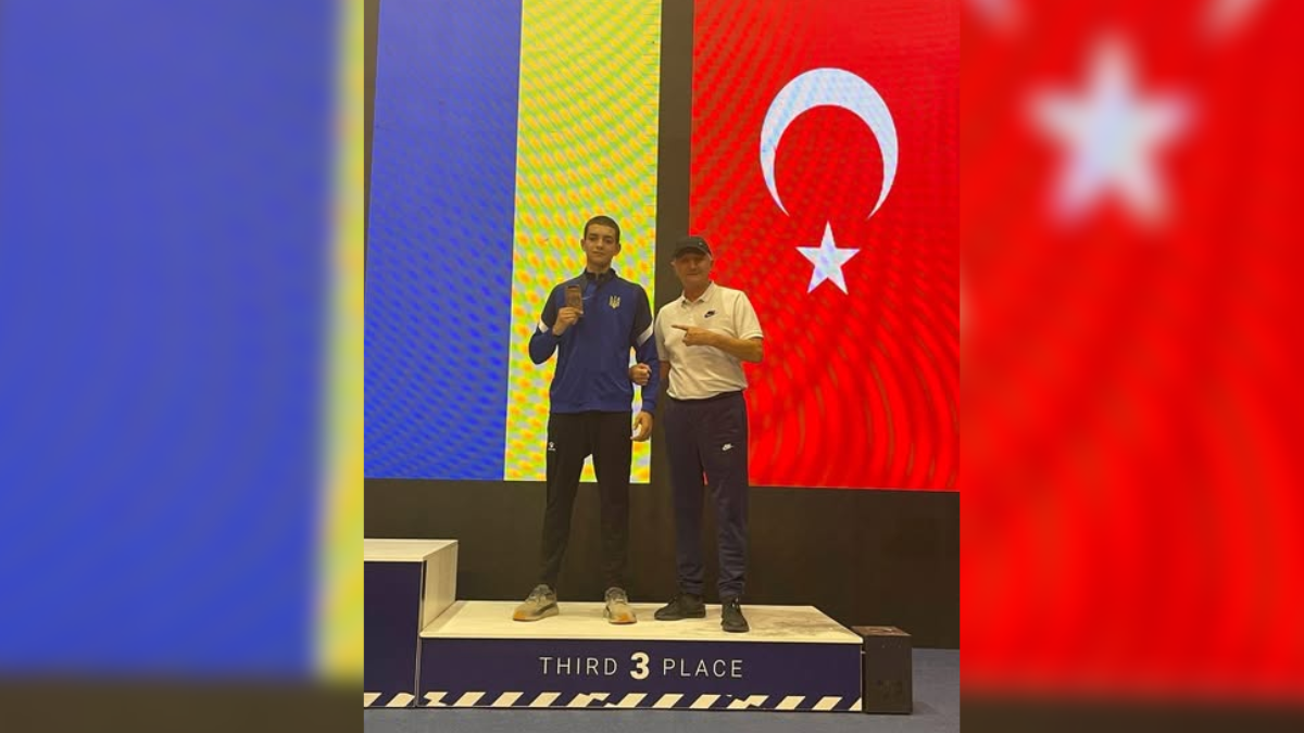 Олександр Томич з тренером Романом Федівим